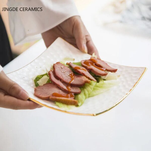 54446-551d8a.jpg Assiette à gâteau en céramique dorée