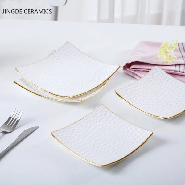 54446-f8b92a.jpg Assiette à gâteau en céramique dorée